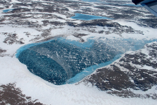 Illustration for article titled Melt Ponds on Ice Sheets Are Chillingly Beautiful